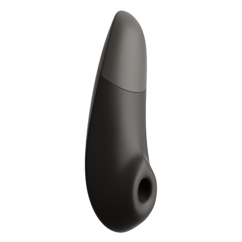A black and gray clitoral stimulator with a curved shape and a circular opening.