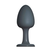 Small grey silicone anal plug with a rounded top and flared base.