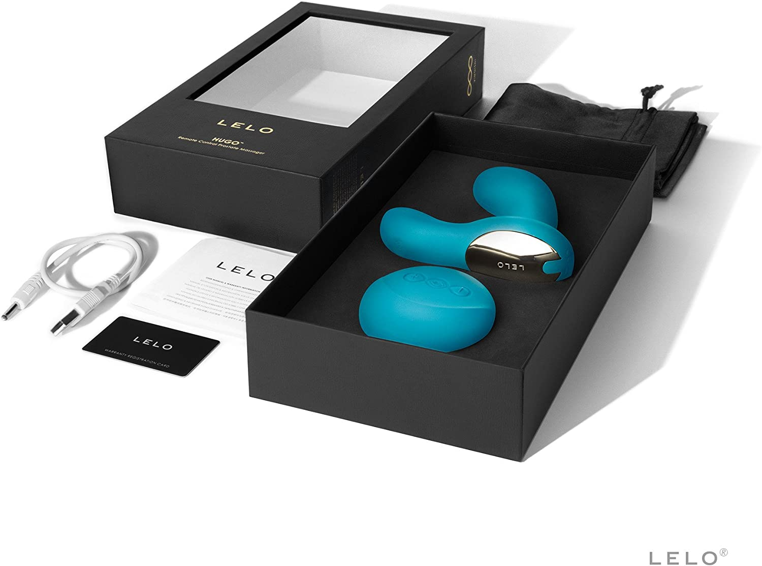 A teal Lelo Hugo remote prostate massager with charging cable and warranty card in a black box.
