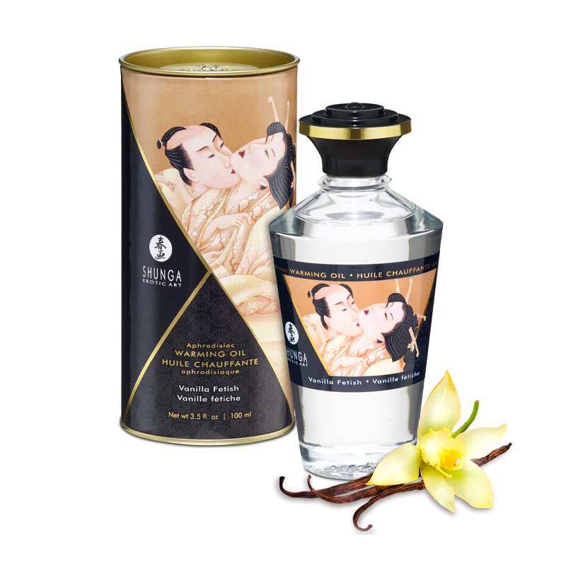 Shunga Vanilla Fetish warming oil in a bottle with a decorative tin and vanilla bean.