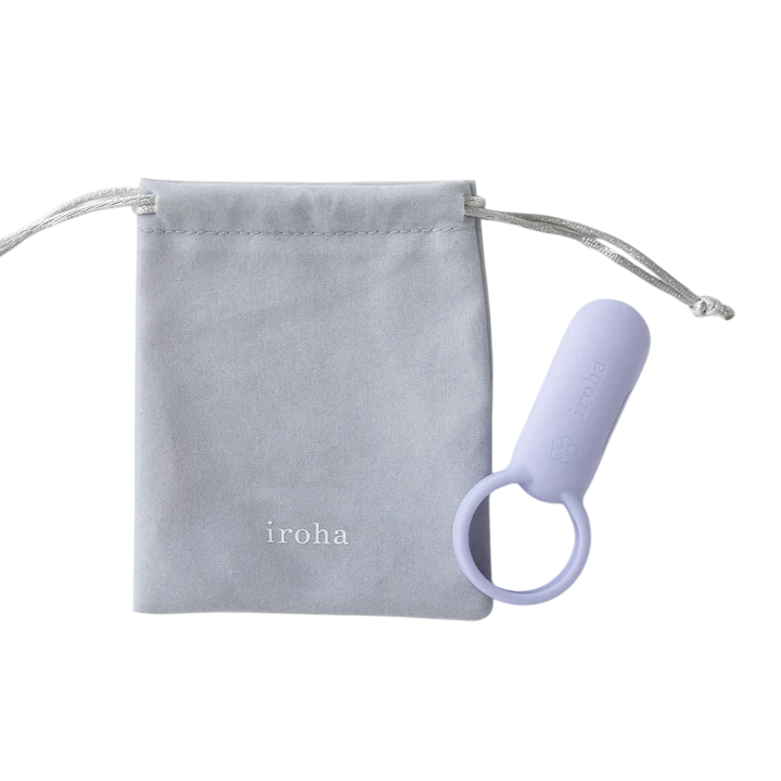 A light purple vibrating ring with a loop sits next to a light gray drawstring pouch with the "iroha" logo.