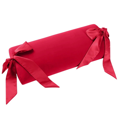Red bolster pillow with silk sashes.