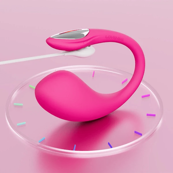 Pink Lovense Lush 4 app-controlled vibrator with charging cable.