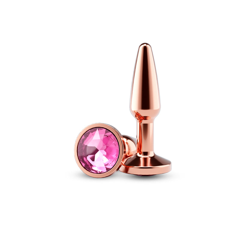 Small rose gold tapered anal plug with a pink gem.