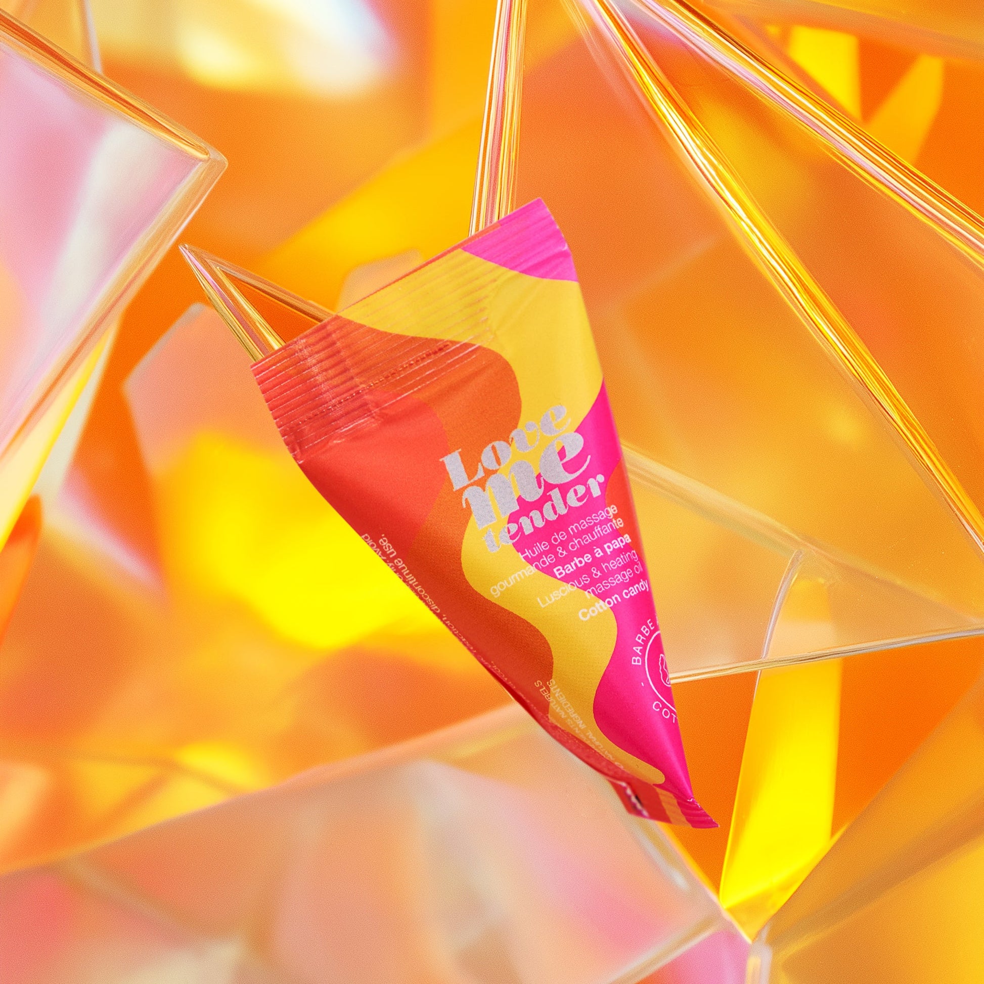 Love Me Tender warming massage oil with cotton candy scent.