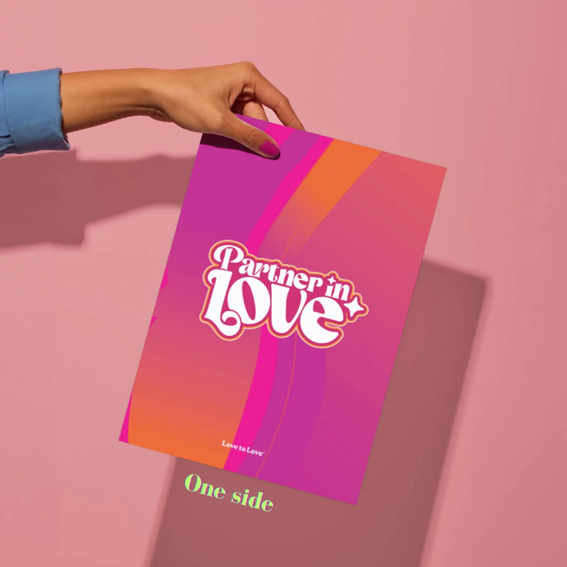 A poster with "Partner in love" and "Love to Love" text held by a hand.