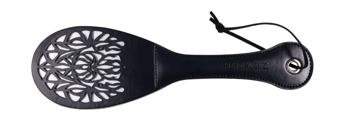 Faux leather spanker paddle with lace cutout and split tip.
