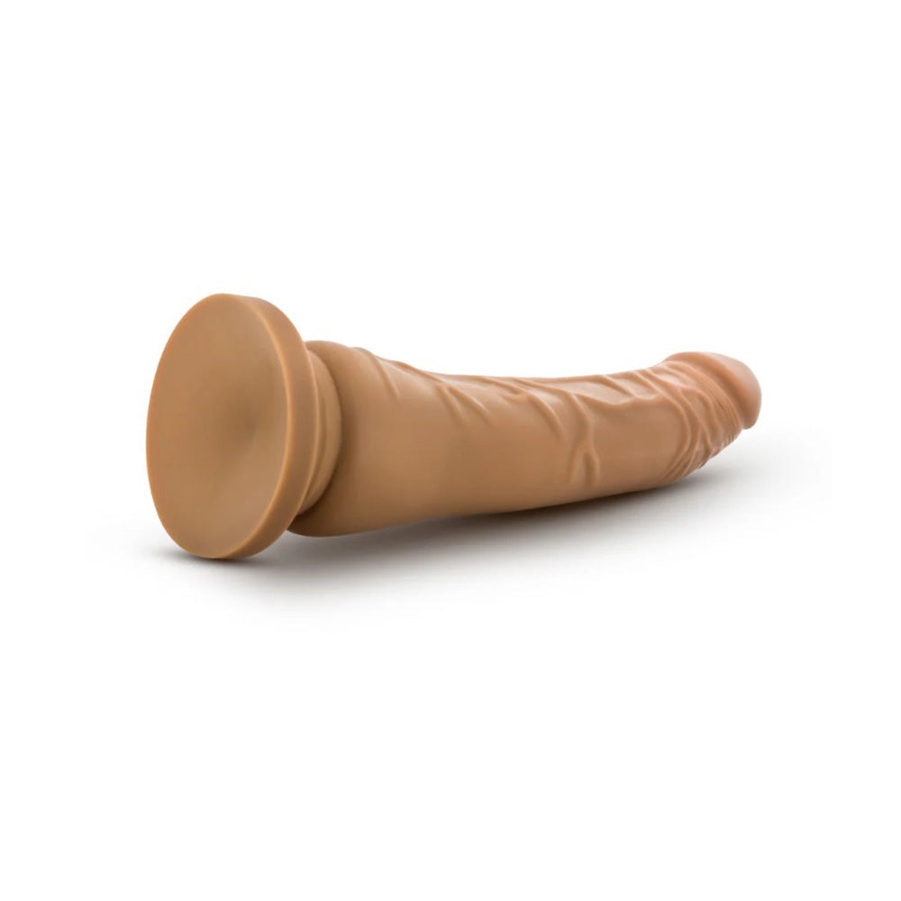 A 9.25-inch blush dual density suction cup dildo with realistic veined shaft.