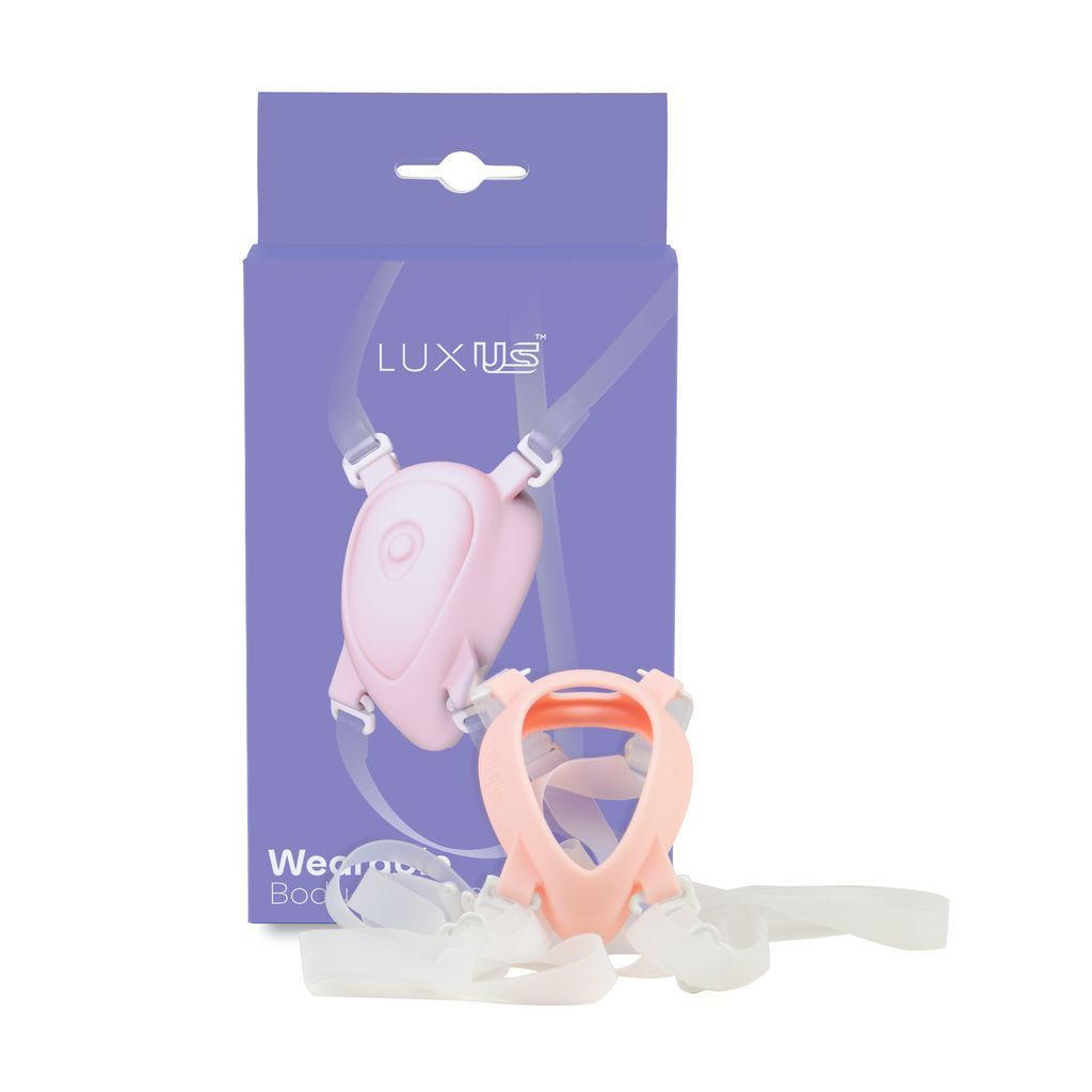 Adjustable pink and white body harness with straps and a pink case.