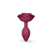 Plum Open Roses silicone anal plug with a flower-shaped handle.