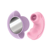 A pink dual-ended vibrator with a purple holder containing a mirror.
