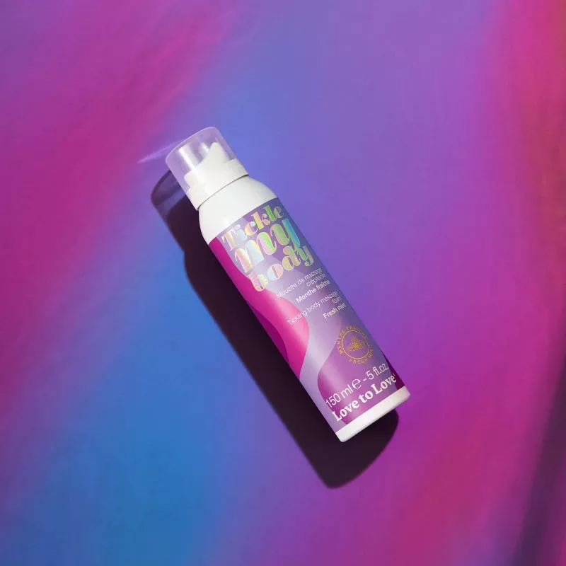 A bottle of Love to Love Tickle Moi Body fresh mint massage foam.