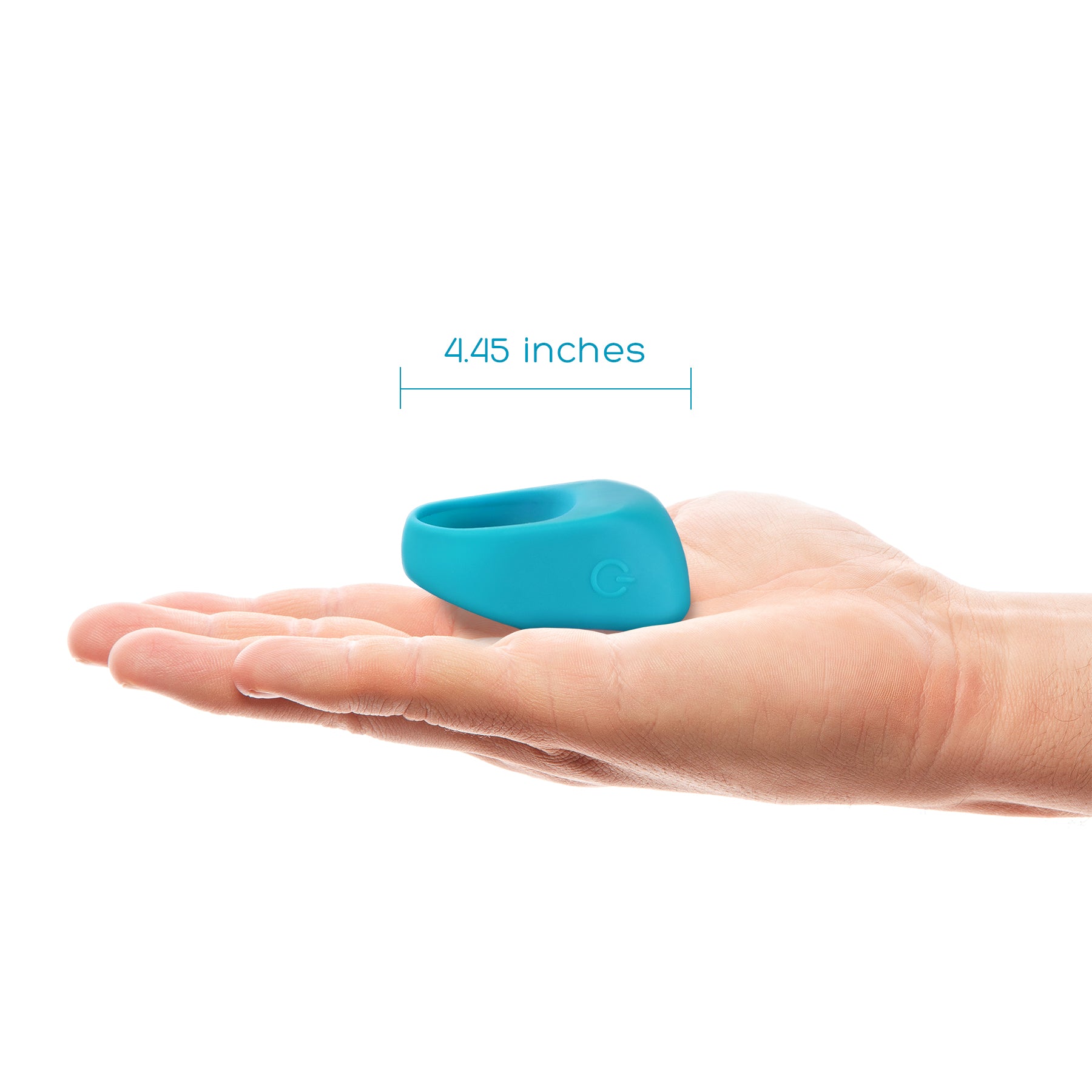 A teal silicone vibrating cock ring with a power button logo rests on a palm, with a measurement of 4.45 inches indicated.