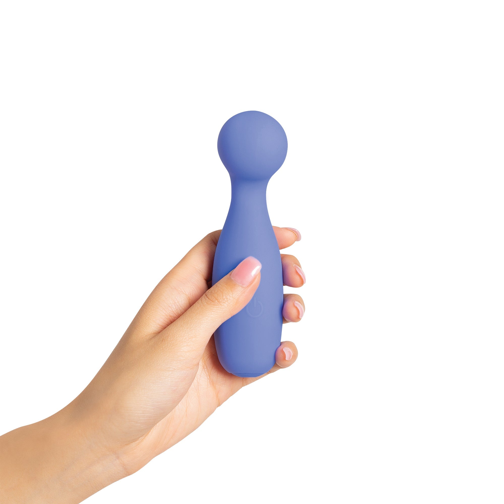 A hand holds a purple vibrating personal massager with a power button symbol.