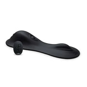 Black clitoral tapper with a remote control.