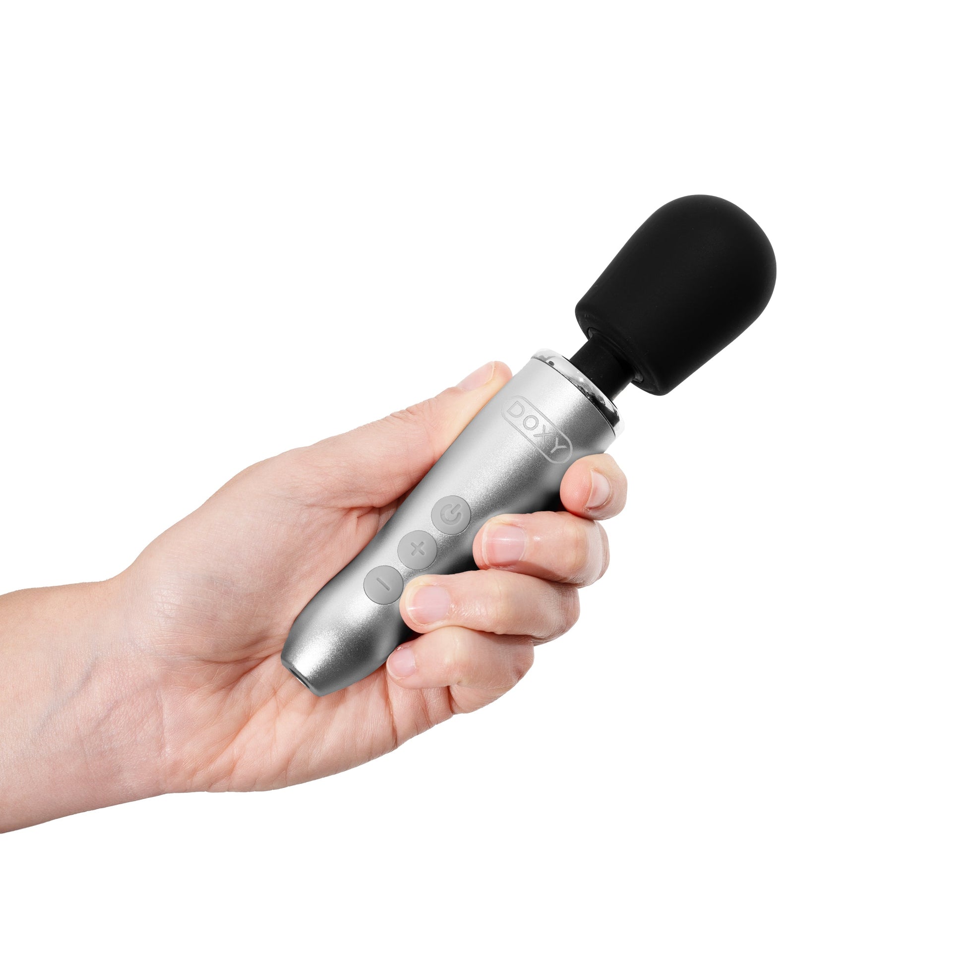 A hand holds a silver Doxy Go wand massager with a black head.