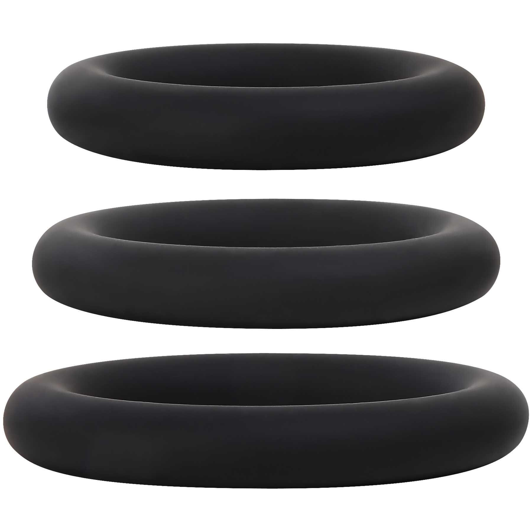 Three black silicone cock rings of varying sizes.