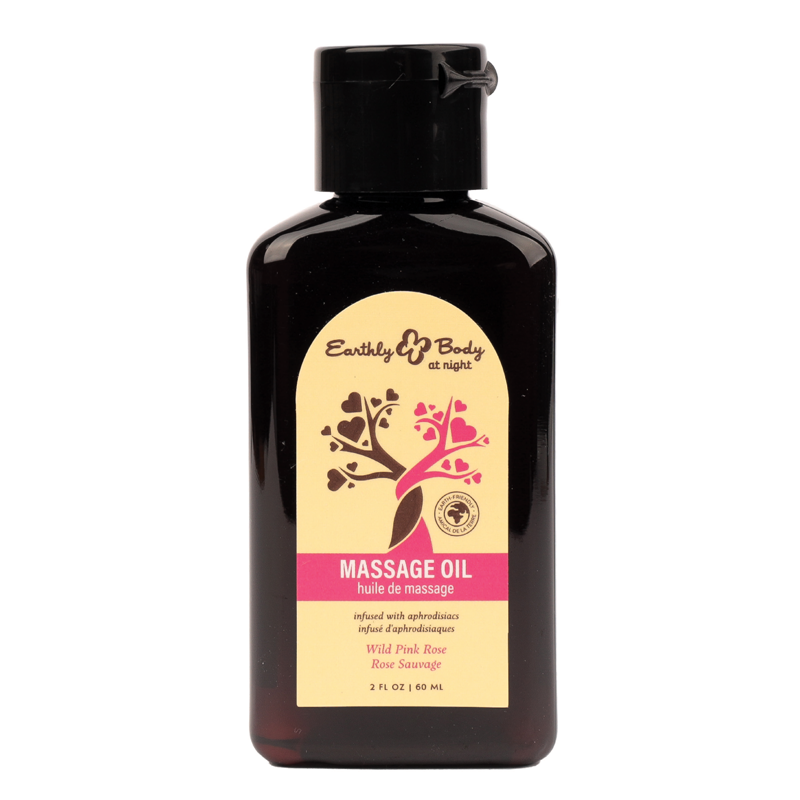 Earthly Body Wild Pink Rose massage oil in a dark bottle with a yellow label.