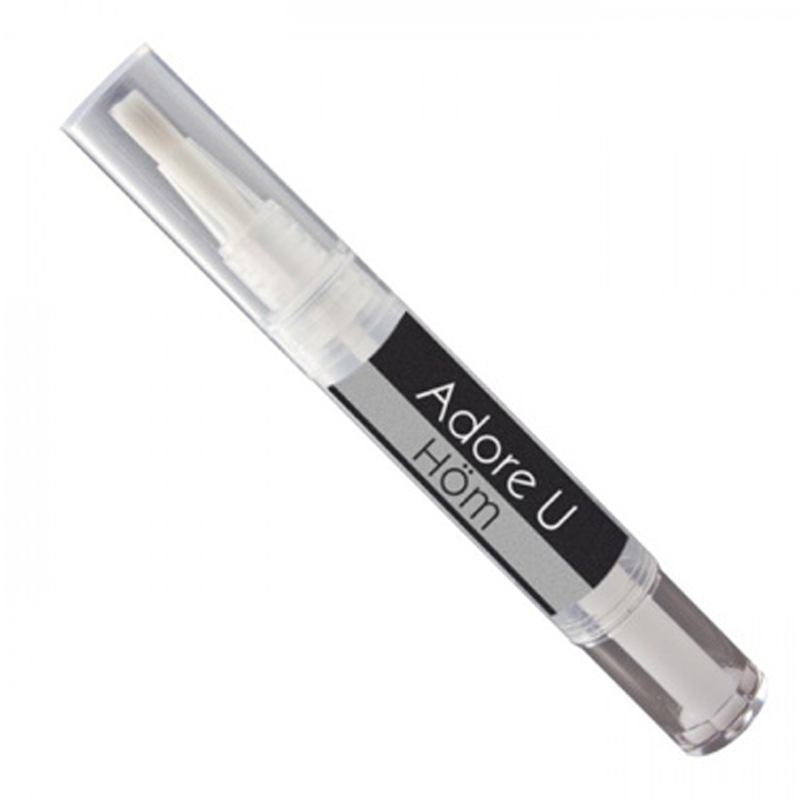 A clear pen with a brush tip, labeled Adore U Höm.