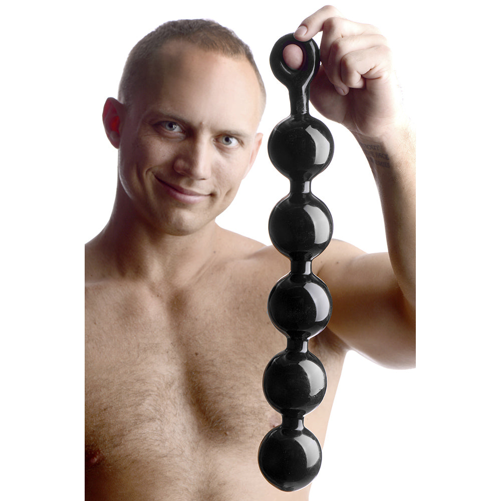 Black anal beads with a pull ring, made of TPE.