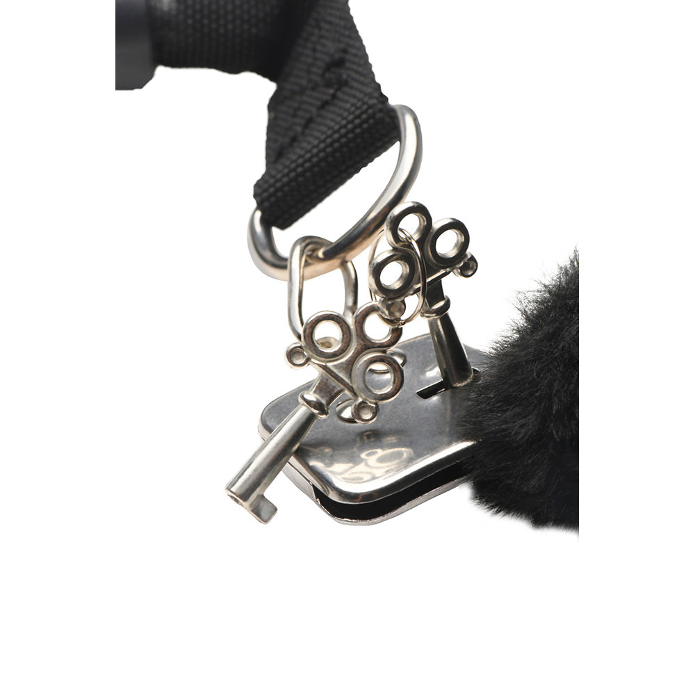 Furry handcuffs with two decorative keys and a black handle.