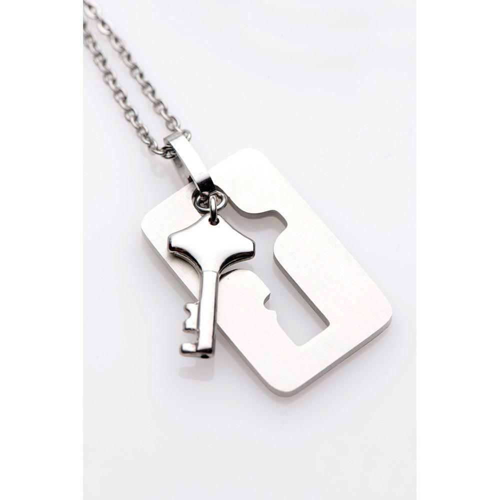 Silver key pendant on a chain with a matching lock-shaped pendant.