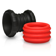 Black ribbed cock ring and red ribbed ball stretcher.