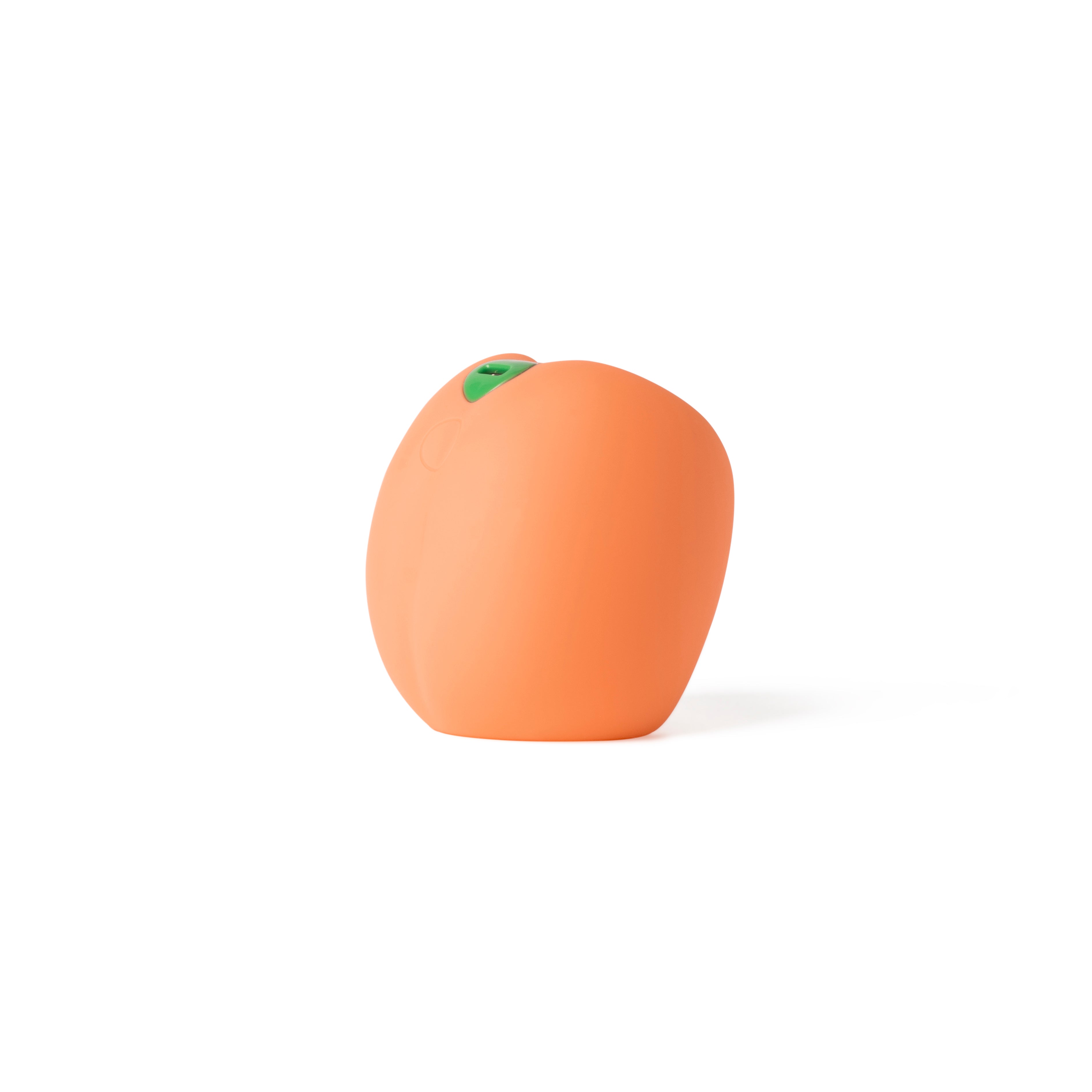 Peach-shaped orange vibrating stroker made of silicone.