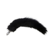Black fur tail butt plug with a stainless steel base.