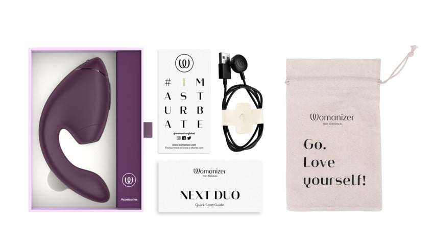 Womanizer Next Duo dual stimulator in dark purple with accessories.