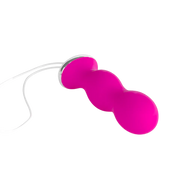Pink pelvic floor trainer with a white string.