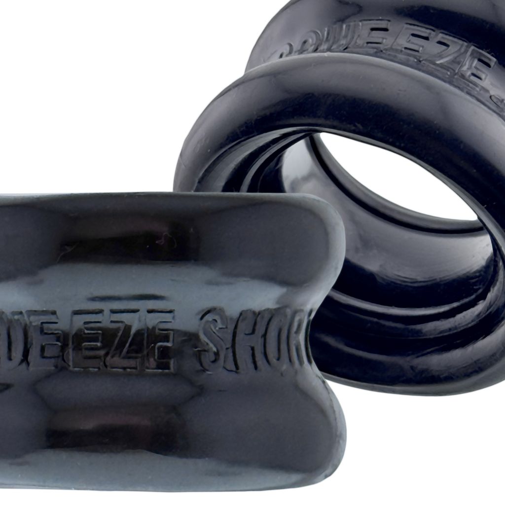 Black rubber ball stretcher with "Squeeze Short" embossed on it.