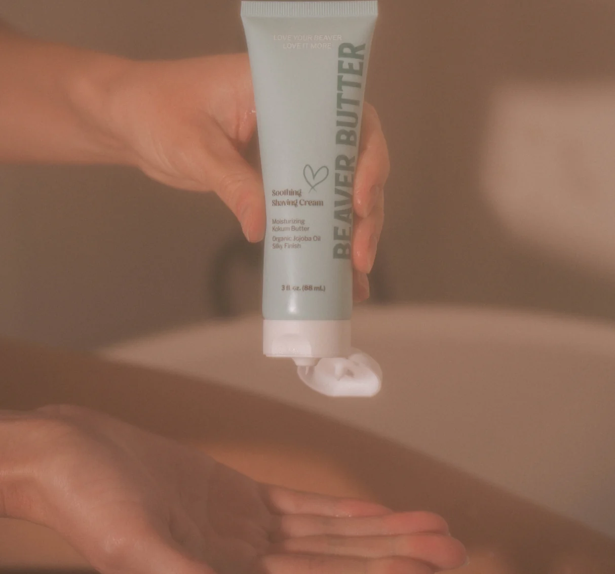 Beaver Butter Soothing Shaving Cream dispensed into a hand.