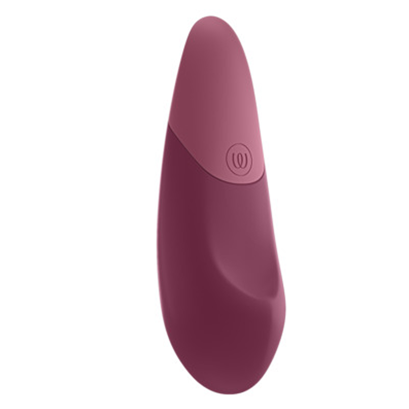 A dusky pink clitoral vibrator with a rounded top and a button with a circular symbol.