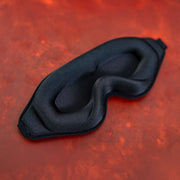 3D padded black sleep mask with contoured eye cups.
