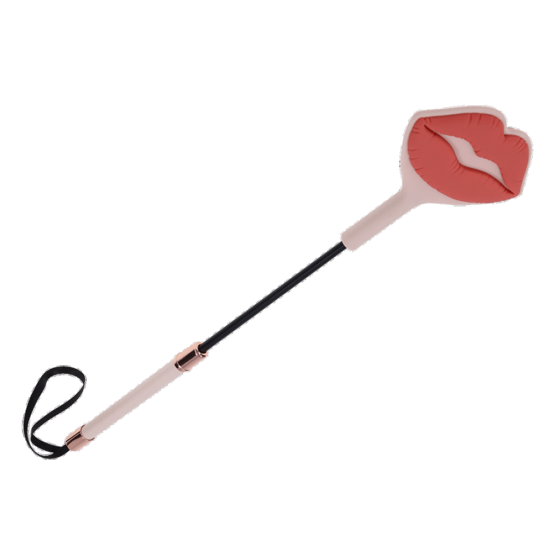 Silicone spanking whip with a pink lip-shaped tip and rose gold accents.