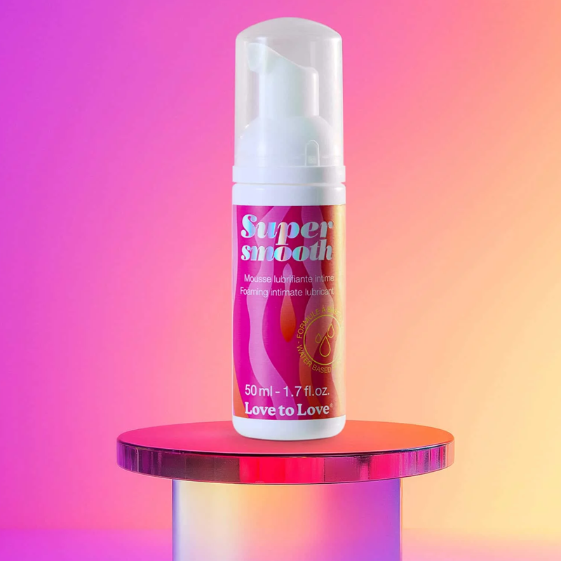 Super Smooth Lubricant Foam by Love to Love on a pink and yellow gradient background.