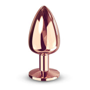 Large rose gold metal anal plug with a tapered tip and flat base.