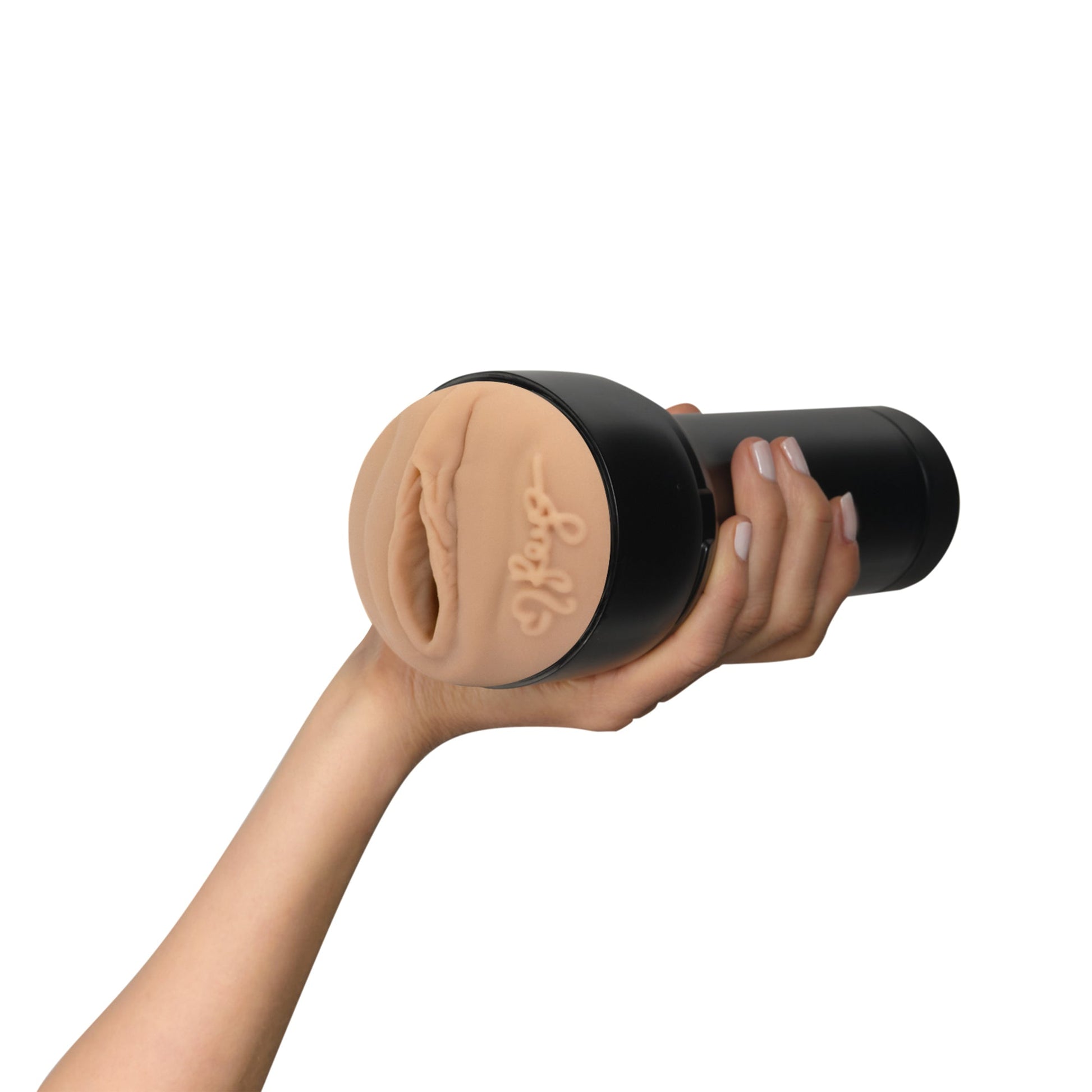 A hand holds a black and tan masturbator sleeve with a realistic texture.