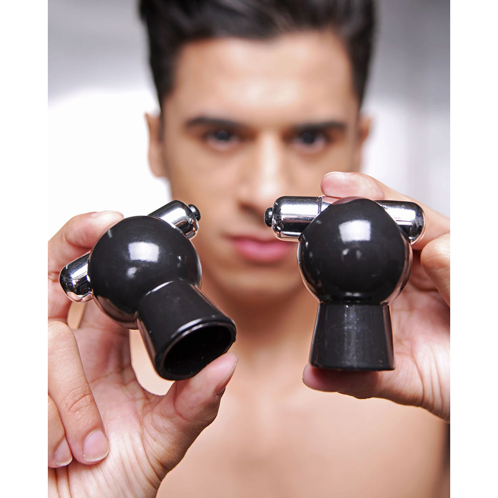 Black vibrating nipple suckers with bullet stimulation.