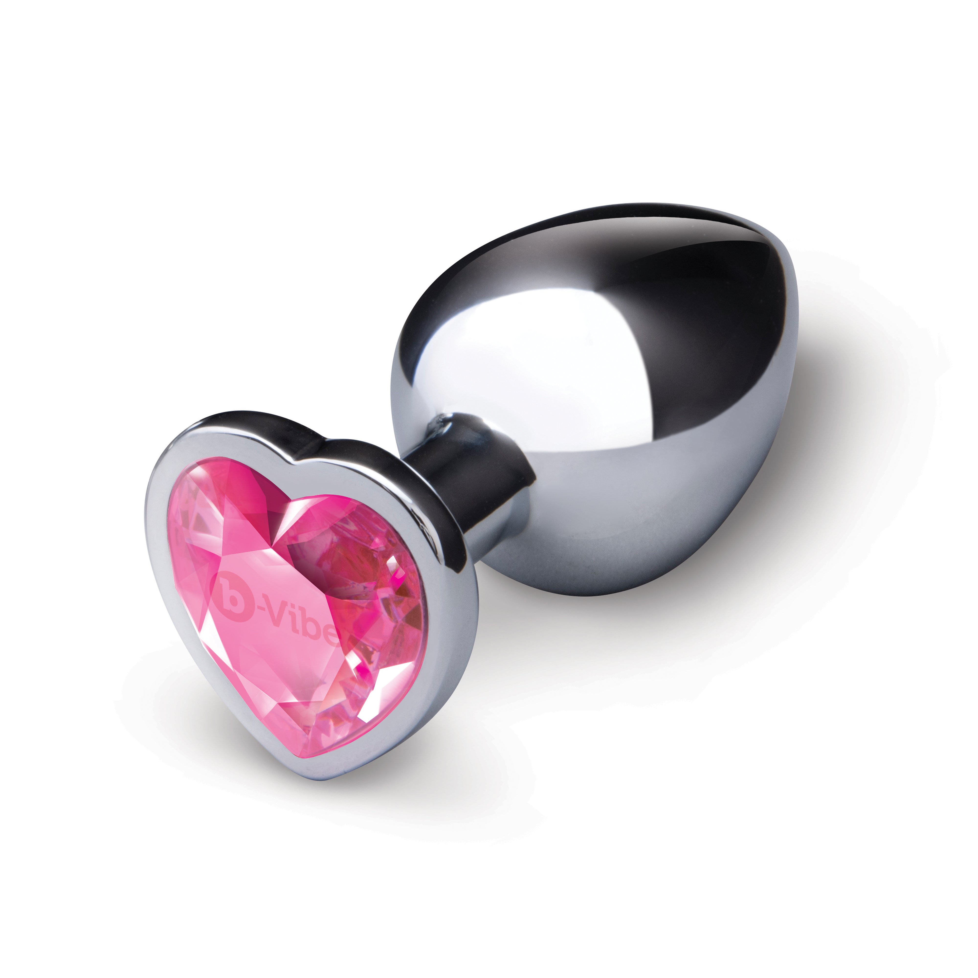A silver metal anal plug with a pink heart-shaped gem base.