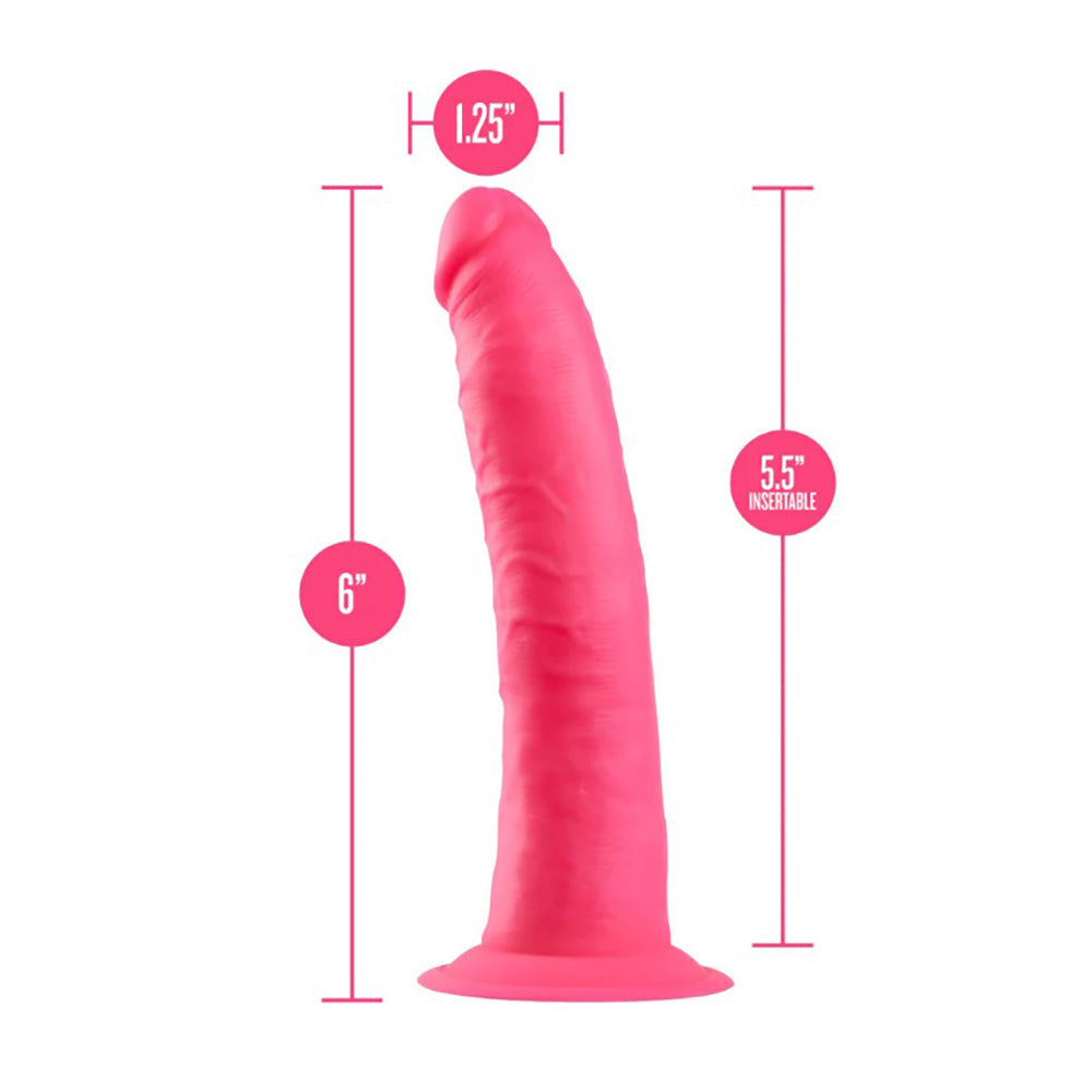 Neon pink dual density silicone dildo with suction cup base, 6 inches wide and 12.5 inches long.