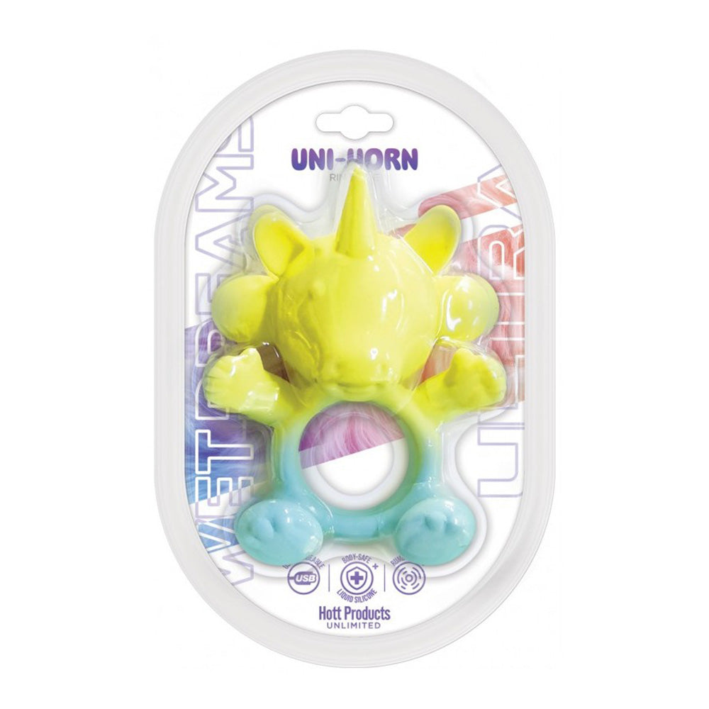 Yellow and blue unicorn-shaped silicone cock ring vibrator in packaging.