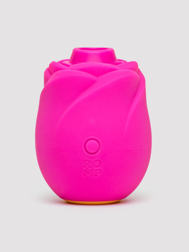 A bright pink rose-shaped clitoral stimulator with ROMP branding.