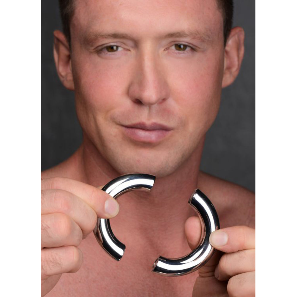 Stainless steel magnetic cock ring with a polished finish.