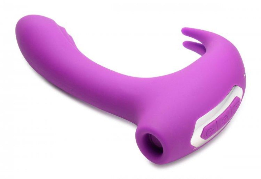 A purple G-spot rabbit vibrator with a curved shaft and control buttons.
