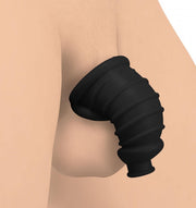 Flexible black silicone chastity cage with ribbed texture.
