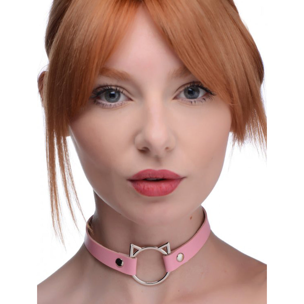 Pink PU leather choker with a silver cat ring and studs.