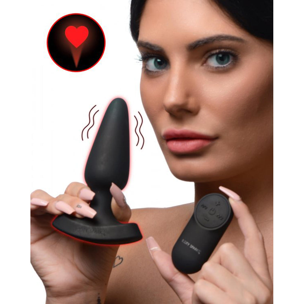 Black silicone anal plug with remote control and a red laser heart.