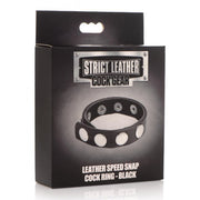 Black leather cock ring with silver snaps on a black box.